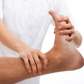 Phisiotherapist making a foot rehabilitation in physiotherapy clinic