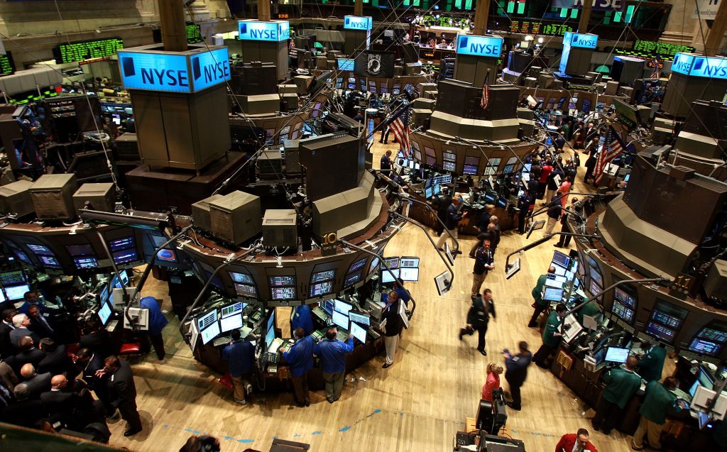 NEW YORK - AUGUST 15:  Traders works on the floor of the New York Stock Exchange (NYSE) August 15, 2008 in New York City. Stocks were up in morning trading on Wall Street as the strengthening U.S. dollar drove global commodity prices down.  (Photo by Spencer Platt/Getty Images)